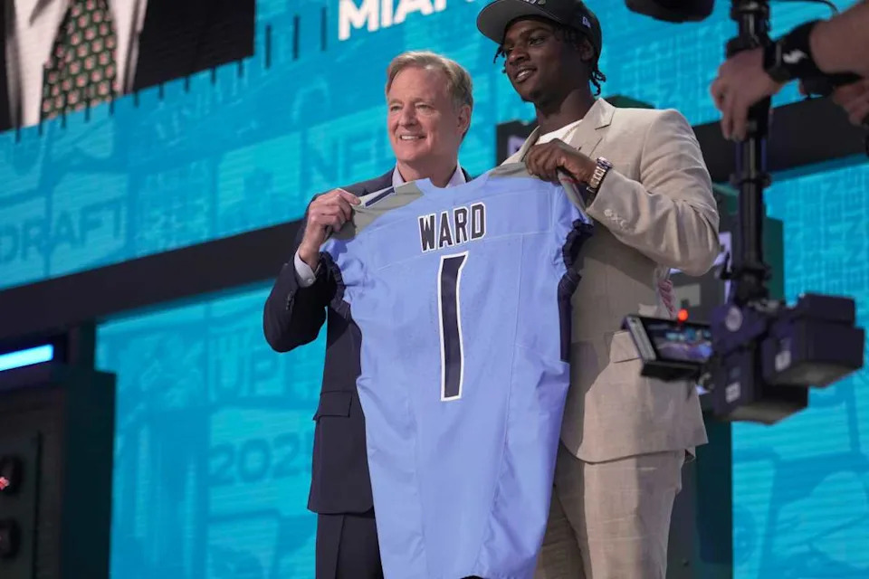 Cam Ward, QB, from Miami holds a jersey with NFL Commissioner Roger Goodell after being selected 1st overall by the Tennessee Titans during the first round of the 2025 NFL Draft at Lambeau Field on April 24, 2025 in Green Bay, Wisconsin.© Mark Hoffman &sol; Milwaukee Journal Sentinel &sol; USA TODAY NETWORK via Imagn Images