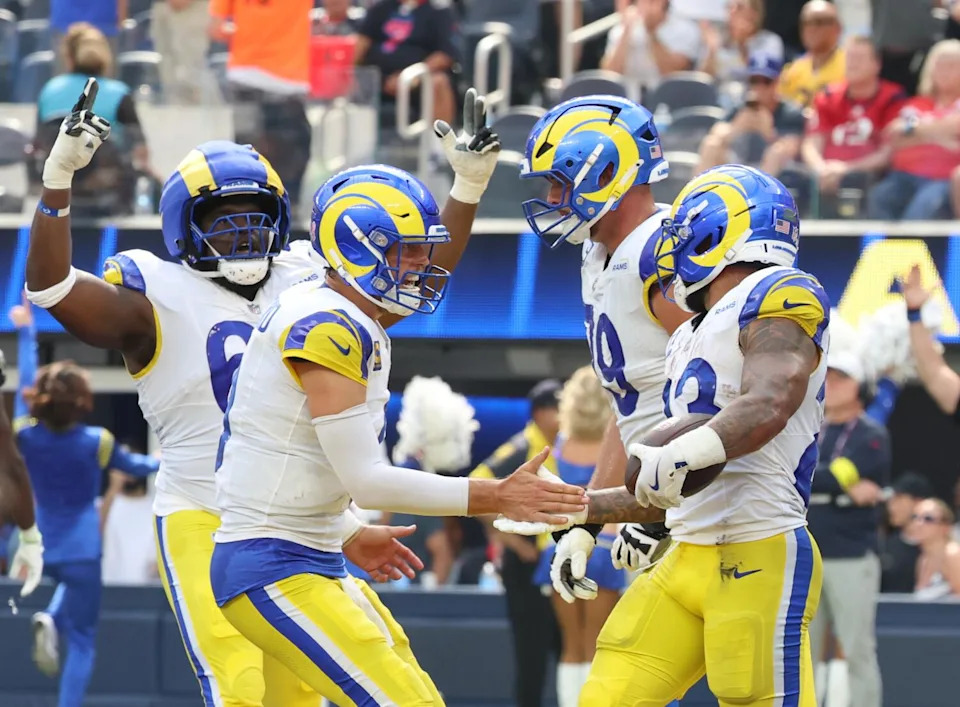 Rams running back Kyren Williams celebrates with Matthew Stafford after scoring a touchdown.