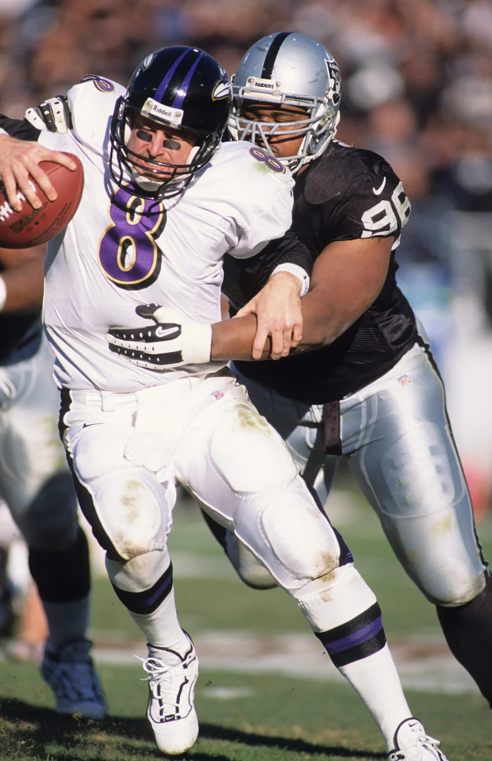 Oakland Raiders defensive tackle Darrell Russell sacks Baltimore Ravens quarterback Trent Dilfer.