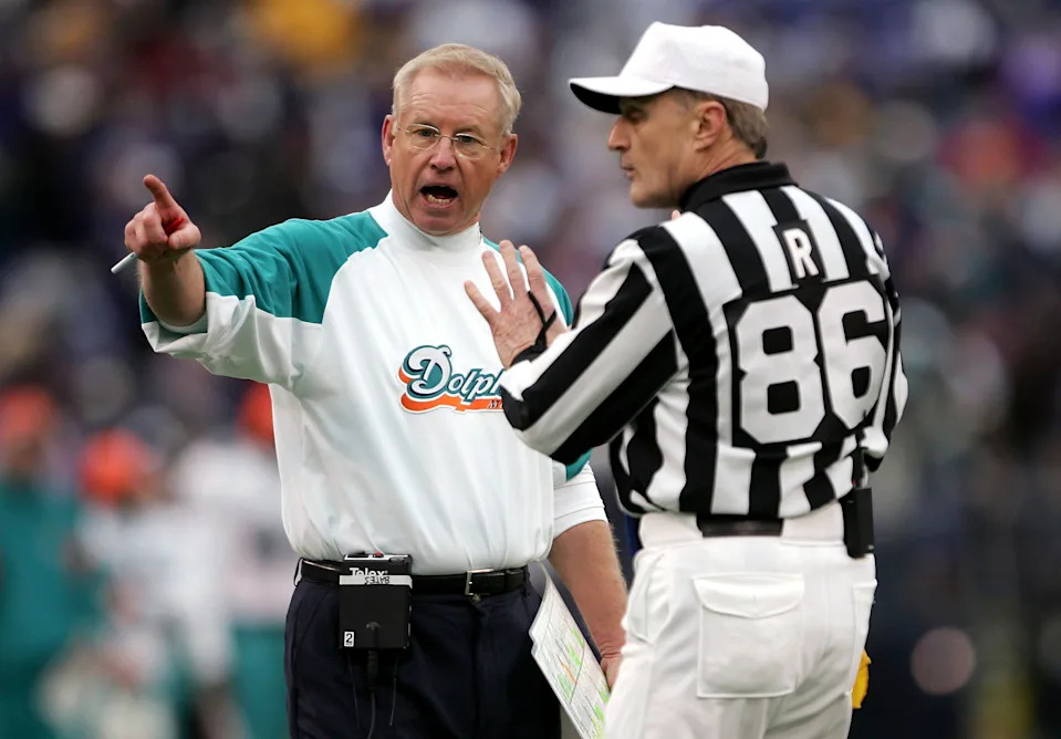 Head coach Jim Bates of the Miami Dolphins protests a call with referee Bernie Kukar.