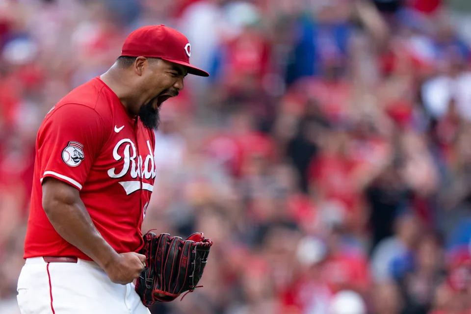 Cincinnati Reds pitcher Tony Santillan (64) reacts to striking out the last batter as the Cincinnati Reds defeat the Chicago Cubs at Great American Ball Park in Cincinnati on Sept. 21, 2025.