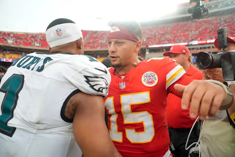 Sep 14, 2025; Kansas City, Missouri, USA; Philadelphia Eagles quarterback Jalen Hurts (1) and Kansas City Chiefs quarterback Patrick Mahomes (15) greet eachother after the game at GEHA Field at Arrowhead Stadium. Mandatory Credit: Jay Biggerstaff-Imagn Images