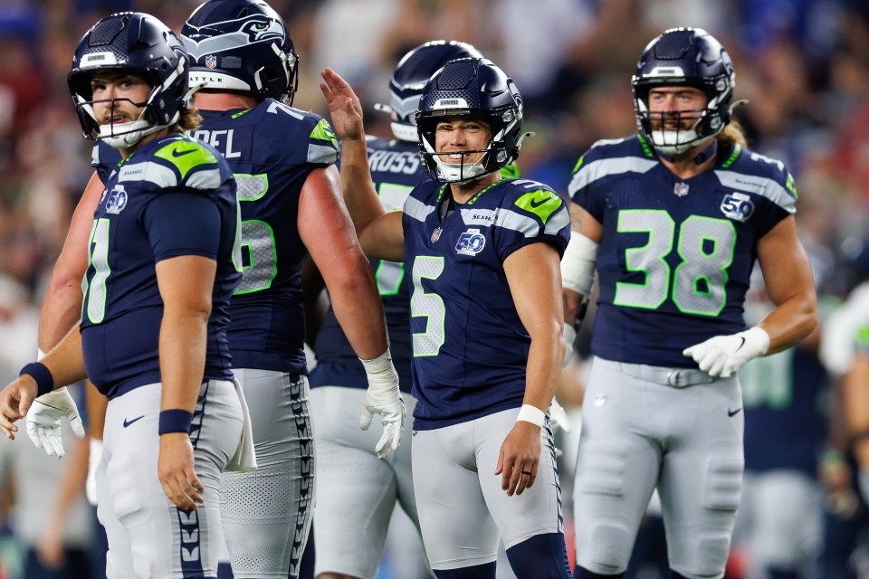 Jason Myers #5 of the Seattle Seahawks celebrates after kicking a field goal with teammates.