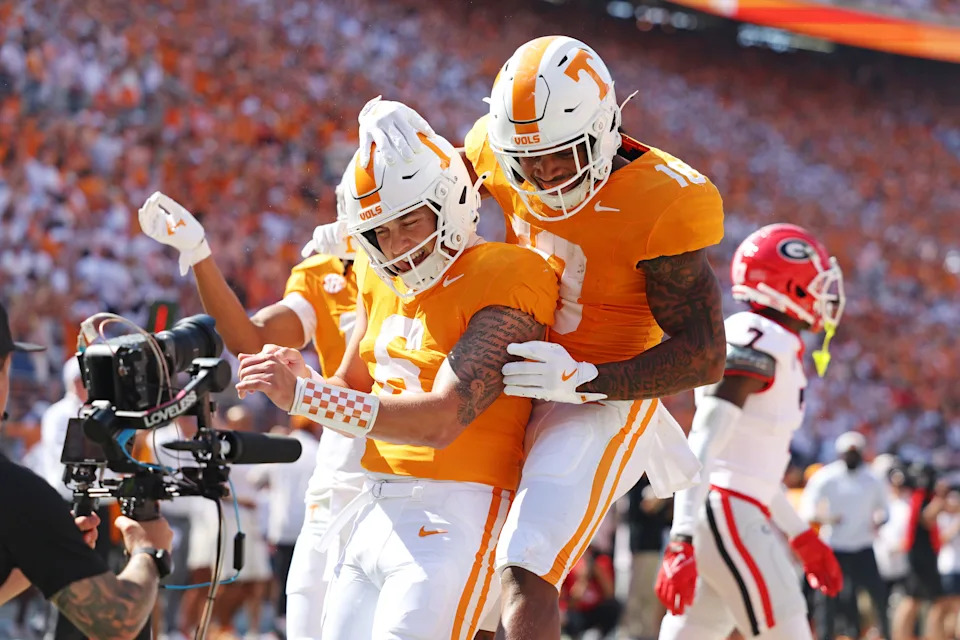 Sep 13, 2025; Knoxville, Tennessee, USA; Tennessee Volunteers quarterback Joey Aguilar (6) celebrates with team mates after scoring a touchdown during the first half after the game at Neyland Stadium. Mandatory Credit: Alan Poizner-Imagn Images