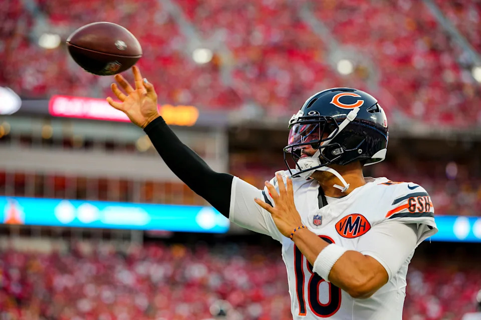 Aug 22, 2025; Kansas City, Missouri, USA; Chicago Bears quarterback Caleb Williams (18) warms up during the first half against the Kansas City Chiefs at GEHA Field at Arrowhead Stadium. Mandatory Credit: Jay Biggerstaff-Imagn Images