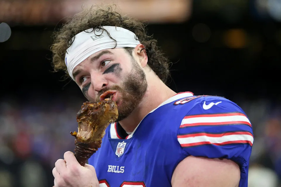 Nov 25, 2021; New Orleans, Louisiana, USA; Buffalo Bills tight end Dawson Knox (88) bites into a turkey leg at the end of their game against the New Orleans Saints at the Caesars Superdome. Mandatory Credit: Chuck Cook-USA TODAY Sports