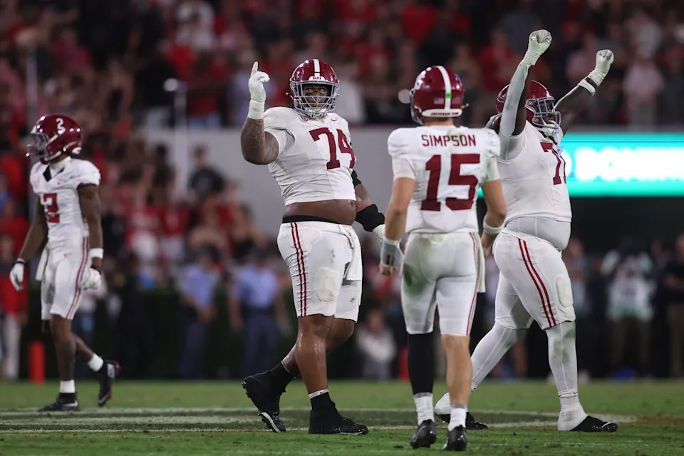 Sep 27, 2025; Athens, Georgia, USA; Alabama Crimson Tide offensive lineman Kadyn Proctor (74) celebrates with quarterback Ty Simpson (15) after defeating the Georgia Bulldogs at Sanford Stadium.