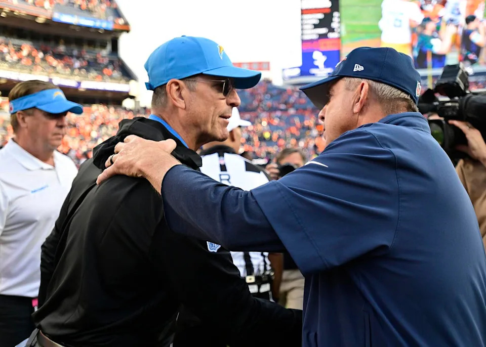 Chargers coach Jim Harbaugh shakes hands with Broncos coach Sean Payton following a Chargers win in October.