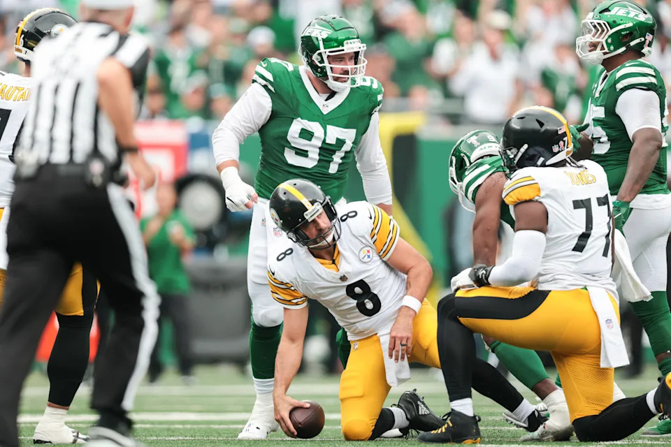 Sep 7, 2025; East Rutherford, New Jersey, USA; Pittsburgh Steelers quarterback Aaron Rodgers (8) reacts after being sacked by New York Jets defensive end Will McDonald IV (9) at MetLife Stadium. Mandatory Credit: Vincent Carchietta-Imagn Images