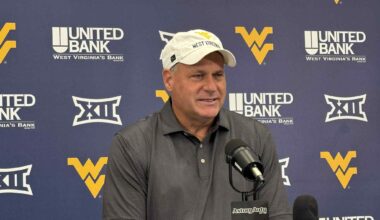 West Virginia quarterback Nicco Marchiol celebrates the touchdown against Pitt