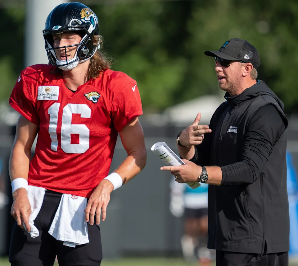 Jacksonville Jaguars quarterback Trevor Lawrence (16) gets coached by Jaguars Head Coach Liam Coen during the Jaguars 14th NFL training camp session at Miller Electric Center Tuesday August 12, 2025 in Jacksonville, Fla. The Jaguars travel to New Orleans to play the Saints this Sunday in their second preseason game. [Doug Engle/Florida Times-Union]