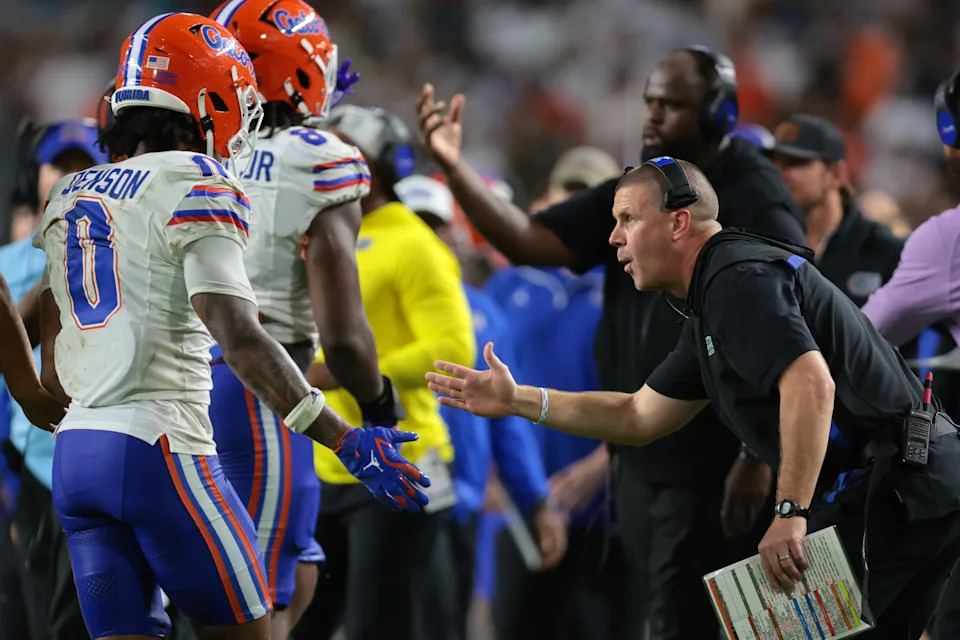 Sep 20, 2025; Miami Gardens, Florida, USA; Florida Gators head coach Billy Napier high-fives defensive back Sharif Denson (0) against the Miami Hurricanes during the second quarter at Hard Rock Stadium. Mandatory Credit: Sam Navarro-Imagn Images