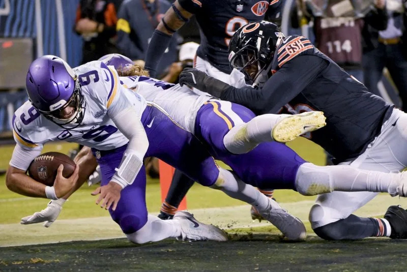 Minnesota Vikings quarterback J.J. McCarthy (L) scores a touchdown against the Chicago Bears on Monday at Soldier Field in Chicago. Photo by Mark Black/UPI