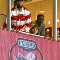 Tight end Travis Kelce, left, of the Kansas City Chiefs and fiance Taylor Swift watch a college game in Kansas City | News