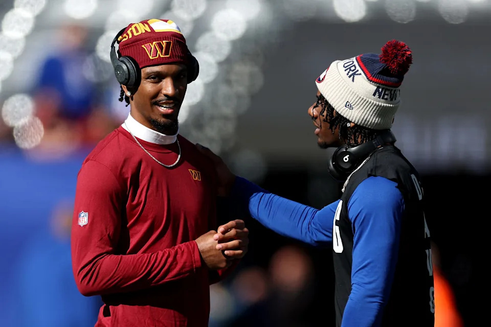 EAST RUTHERFORD, NEW JERSEY - NOVEMBER 03: (L-R) Jayden Daniels #5 of the Washington Commanders and Malik Nabers #1 of the New York Giants interact before the game at MetLife Stadium on November 03, 2024 in East Rutherford, New Jersey. (Photo by Luke Hales/Getty Images)