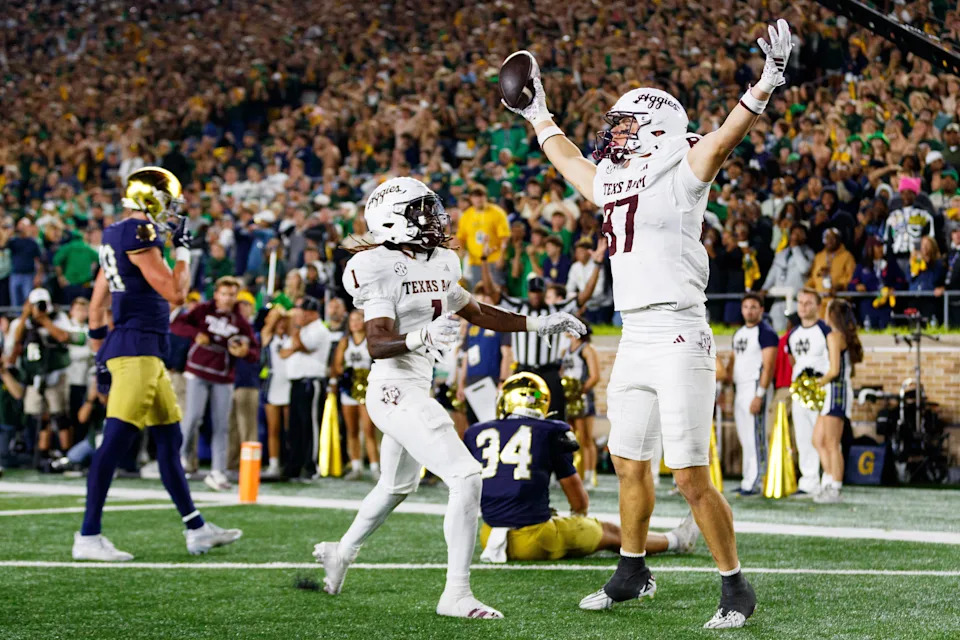 Texas A&M tight end Nate Boerkircher (87) celebrates after scoring a touchdown to tie the game in the second half of a NCAA football game against Notre Dame at Notre Dame Stadium on Saturday, Sept. 13, 2025, in South Bend. The extra point scored after this touchdown put Texas A&M ahead 41-40 to win the game.