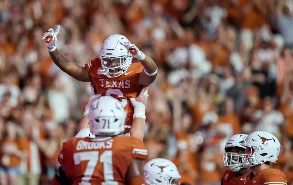 AUSTIN, TEXAS - SEPTEMBER 20: Christian Clark #6 of the Texas Longhorns is congratulated by teammates after a touchdown run in the second half against the Sam Houston State Bearkats at Darrell K Royal-Texas Memorial Stadium on September 20, 2025 in Austin, Texas. (Photo by Tim Warner/Getty Images)