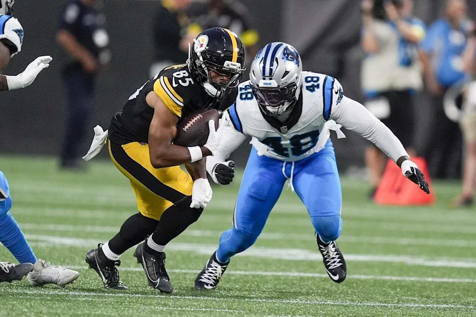 Pittsburgh Steelers wide receiver Ke'Shawn Williams (85) tries to elude Carolina Panthers linebacker Thomas Incoom (48) during the second quarter on Aug 21.