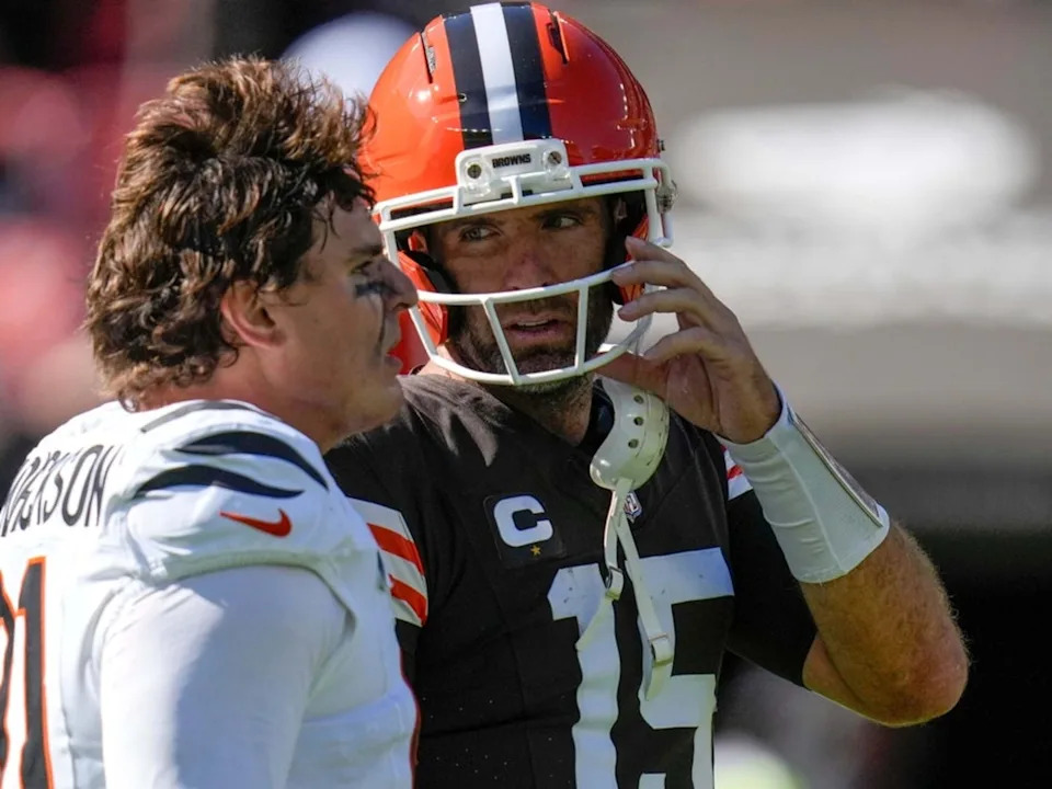 Cincinnati Bengals defensive end Trey Hendrickson (91) and Cleveland Browns quarterback Joe Flacco (15) talk after the fourth quarter of the NFL Week 1 game at Huntington Bank Field in Cleveland on Sunday, Sept. 7, 2025.