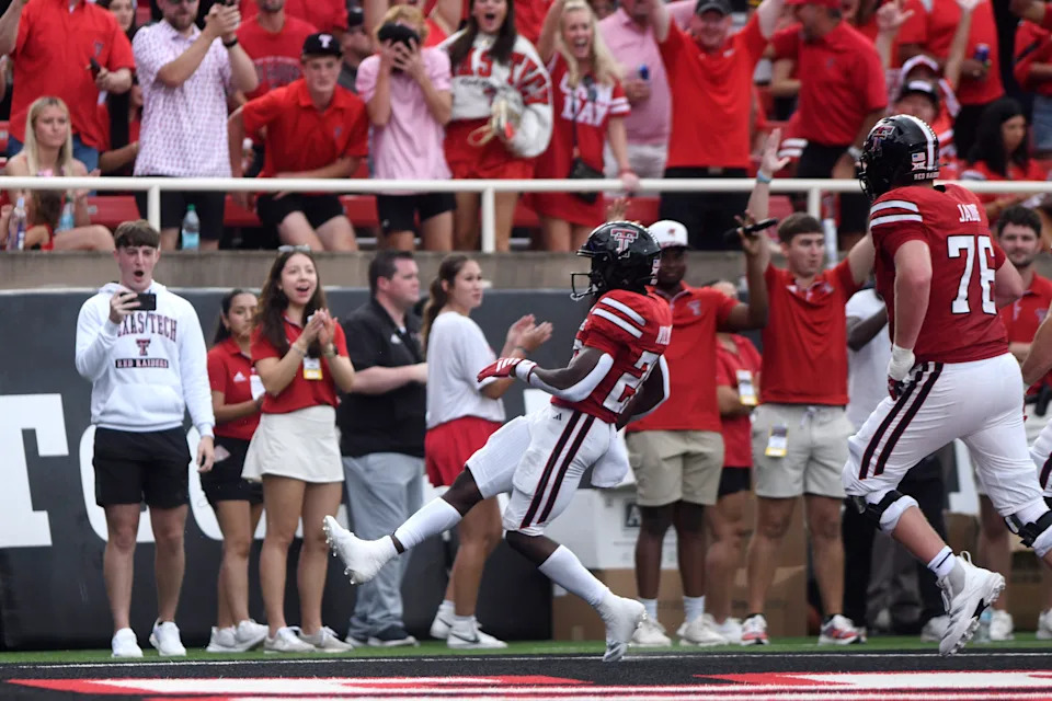 Texas Tech running back J'Koby Williams (20) scores a touchdown during the first half of an NCAA college football game against Oregon State, Saturday, Sept. 13, 2025, in Lubbock, Texas. (AP Photo/Annie Rice)