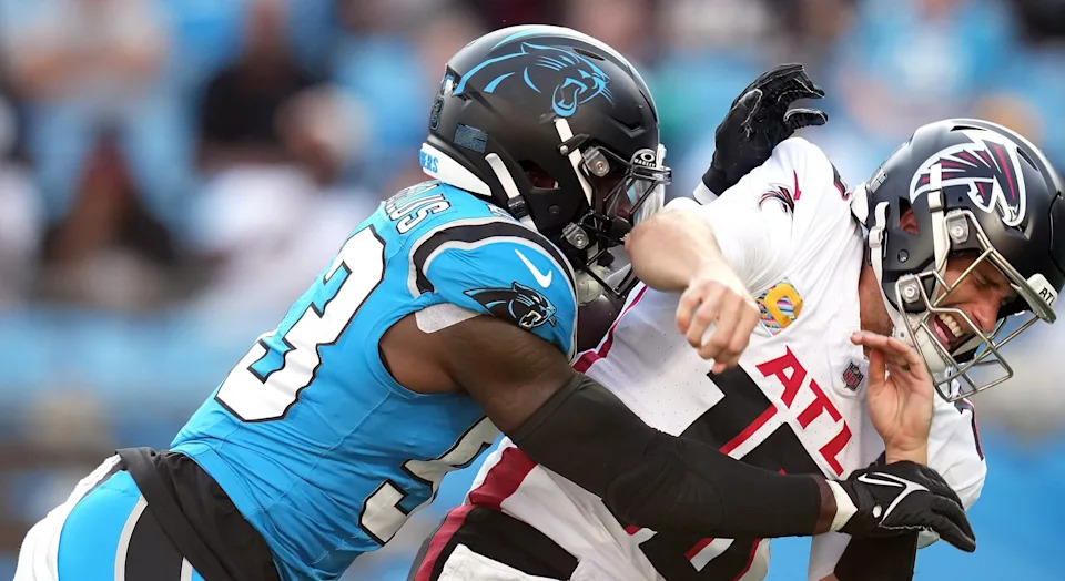 CHARLOTTE, NORTH CAROLINA - OCTOBER 13: Claudin Cherelus #53 of the Carolina Panthers pressures Kirk Cousins #18 of the Atlanta Falcons in the second quarter at Bank of America Stadium on October 13, 2024 in Charlotte, North Carolina. (Photo by Grant Halverson/Getty Images)