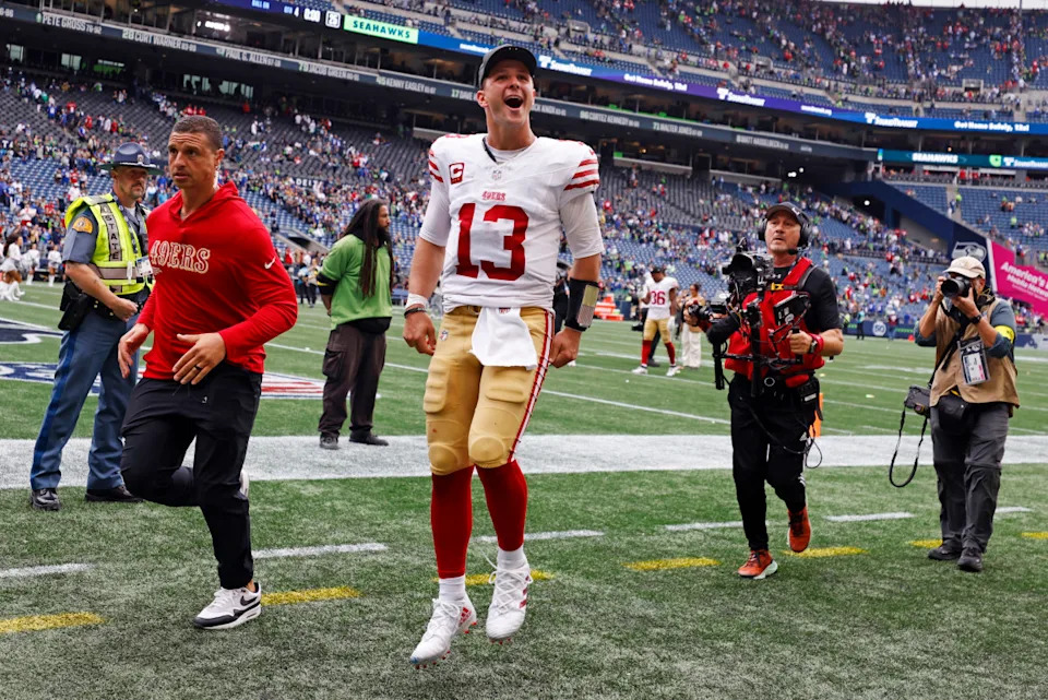 Sep 7, 2025; Seattle, Washington, USA; San Francisco 49ers quarterback Brock Purdy (13) reacts after the game against the Seattle Seahawks during the fourth quarter at Lumen Field. Mandatory Credit: Joe Nicholson-Imagn Images