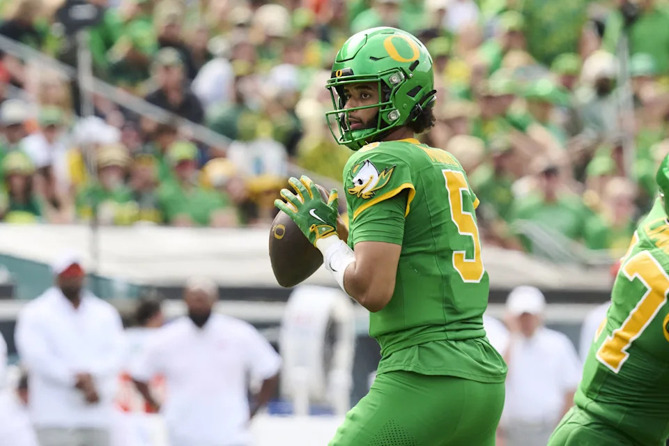 Sep 6, 2025; Eugene, Oregon, USA; Oregon Ducks quarterback Dante Moore (5) looks down field for a receiver during the second half against the Oklahoma State Cowboys at Autzen Stadium. Mandatory Credit: Troy Wayrynen-Imagn Images
