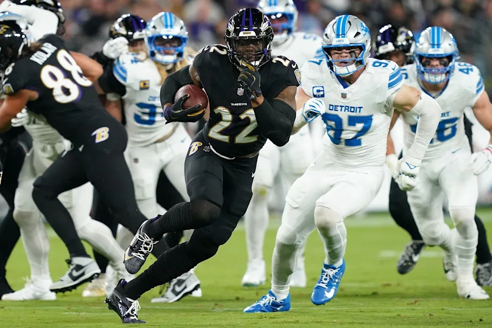 Sep 22, 2025; Baltimore, Maryland, USA; Baltimore Ravens running back Derrick Henry (22) rushes the ball against the Detroit Lions during the first half at M&T Bank Stadium. Mandatory Credit: Mitch Stringer-Imagn Images