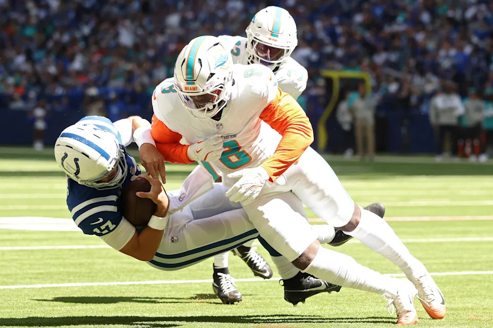 Daniel Jones of the Indianapolis Colts is tackled by Matthew Judon of the Miami Dolphins during the first quarter at Lucas Oil Stadium on Sept. 7, 2025 in Indianapolis.