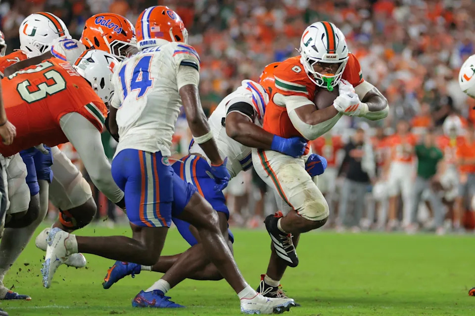 Sep 20, 2025; Miami Gardens, Florida, USA; Miami Hurricanes running back CharMar Brown (6) carries the football against the Florida Gators during the fourth quarter at Hard Rock Stadium. Mandatory Credit: Sam Navarro-Imagn Images