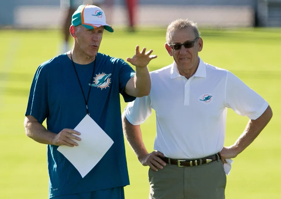 Miami Dolphins head coach Joe Philbin and Miami Dolphins owner Stephen Ross watch the first day of Dolphins training camp in Davie, Florida on July 25, 2014.