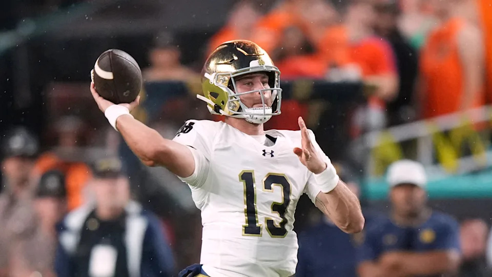 Notre Dame quarterback CJ Carr (13) makes a pass attempt during an NCAA football game on Sunday, Aug. 31, 2025 in Miami. (AP Photo/Peter Joneleit)