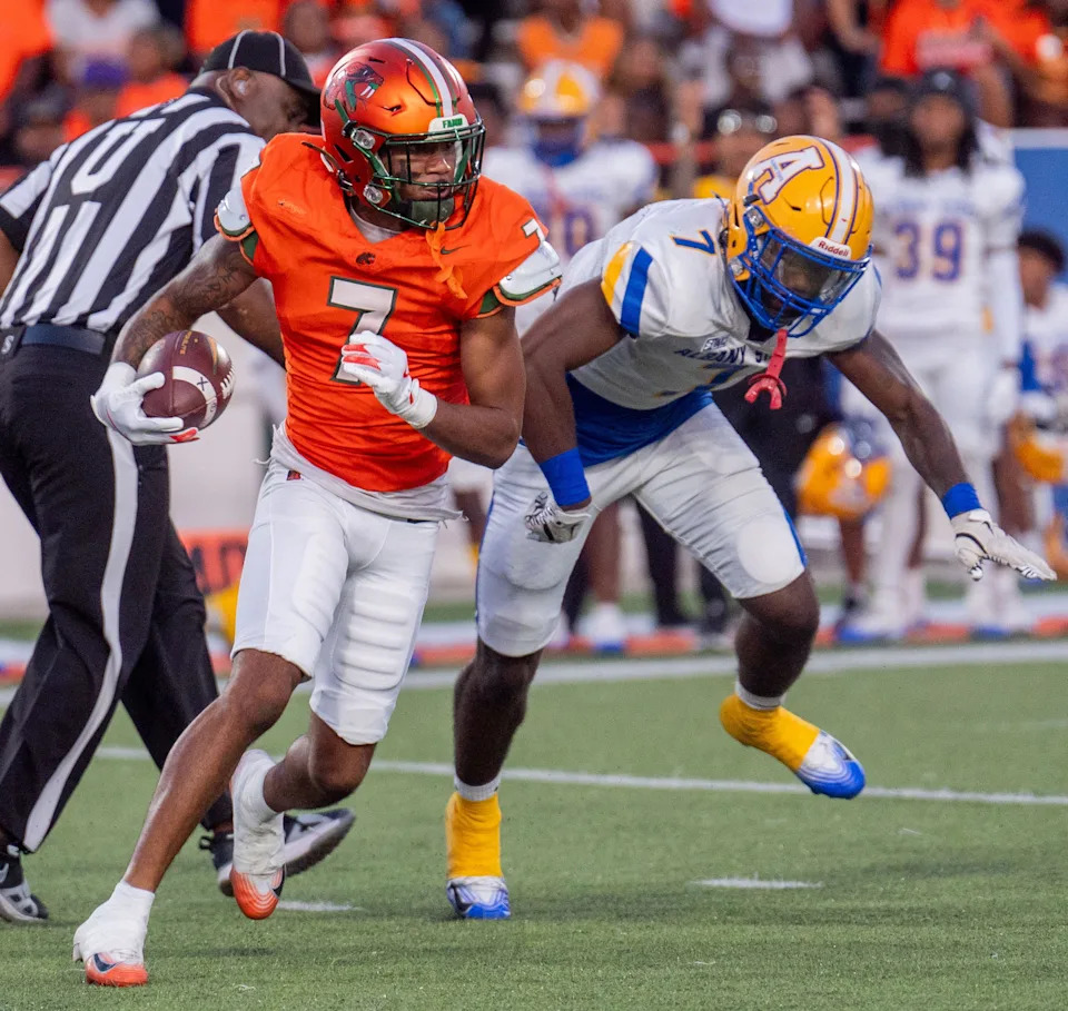 Florida A&M Rattlers wide receiver Kenari Wilcher (7) dodges defenders. The Florida A&M Rattlers defeated the Albany State Golden Rams during the first home game of the season on Saturday, Sept. 13, 2025.