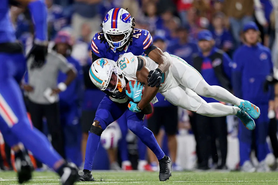 ORCHARD PARK, NEW YORK - SEPTEMBER 18: Dee Eskridge #82 of the Miami Dolphins is tackled by Dorian Strong #43 of the Buffalo Bills in the second half of the game at Highmark Stadium on September 18, 2025 in Orchard Park, New York. (Photo by Bryan M. Bennett/Getty Images)