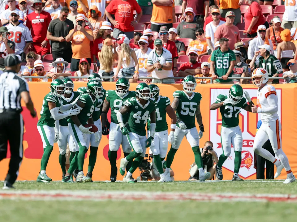 Sep 21, 2025; Tampa, Florida, USA; New York Jets defensive end Will McDonald IV (9) is congratulated after he ran a blocked punt back for a touchdown against the Tampa Bay Buccaneers during the second half at Raymond James Stadium. Mandatory Credit: Kim Klement Neitzel-Imagn Images