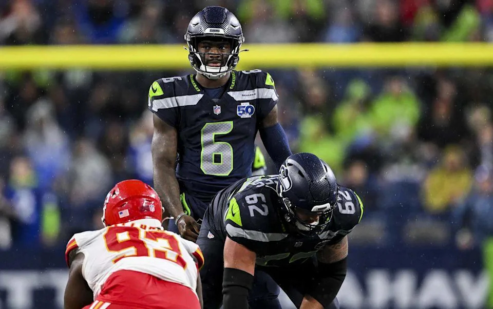 Seattle Seahawks quarterback Jalen Milroe (6) looks on behind the offensive line during the fourth quarter of the preseason game against the Kansas City Chiefs at Lumen Field, on Friday, Aug. 15, 2025, in Seattle.
