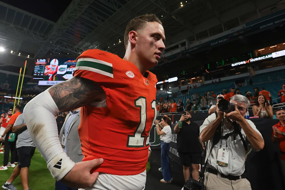 Sep 13, 2025; Miami Gardens, Florida, USA; Miami Hurricanes quarterback Carson Beck (11) walks off the field after the game against the South Florida Bulls at Hard Rock Stadium. Mandatory Credit: Sam Navarro-Imagn Images