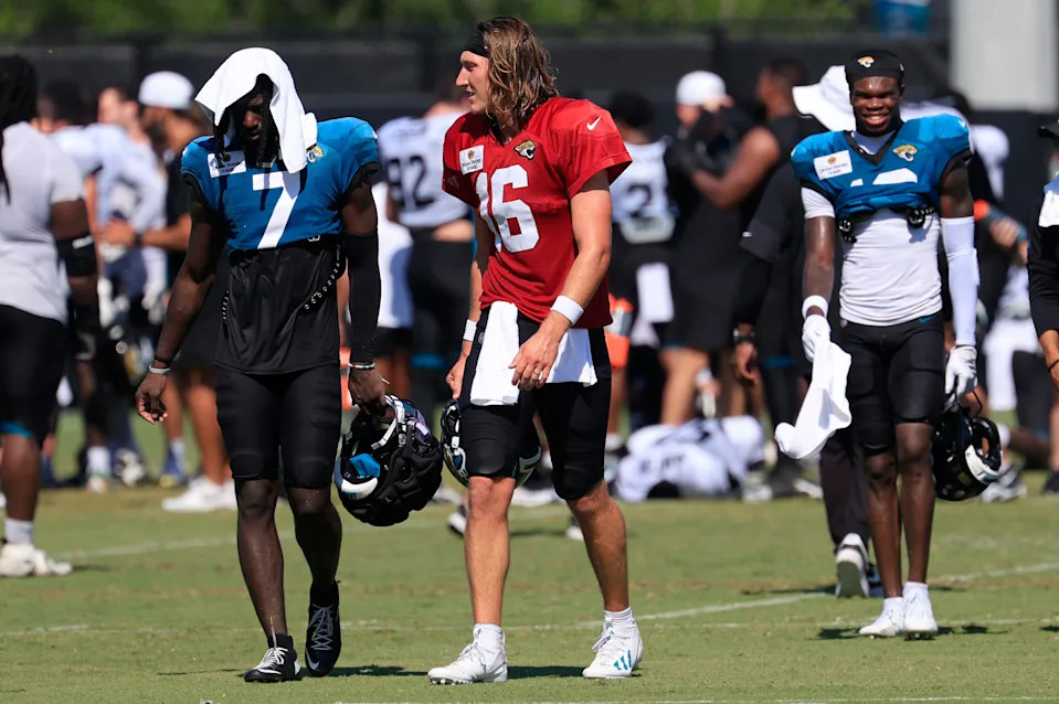 Jacksonville Jaguars quarterback Trevor Lawrence (16) talks with wide receiver Brian Thomas Jr. (7) as they walk off the field with wide receiver Travis Hunter (12), right, after an NFL training camp session at the Miller Electric Center, Tuesday, July 29, 2025, in Jacksonville, Fla. [Corey Perrine/Florida Times-Union]