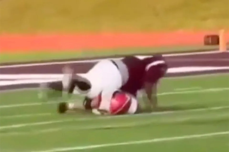 Kalamazoo Central player leaps onto the Lakeshore player, who was already curled up on the ground in a move that his teammate called ‘illegal’ (WNDU)