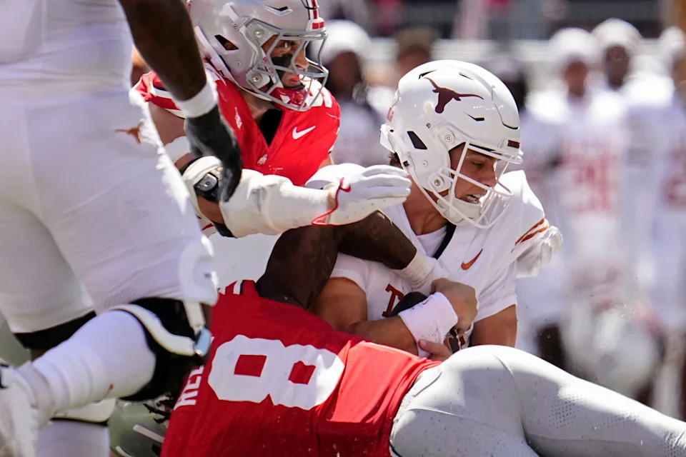 Ohio State Buckeyes linebacker Arvell Reese (8) tackles Texas Longhorns quarterback Arch Manning (16) during the first half of the NCAA football game at Ohio Stadium on Aug. 30, 2025.