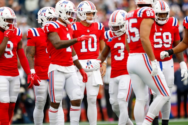 New England Patriots quarterback Drake Maye (10) in the huddle during the first half of an NFL football game against the Houston Texans, Sunday, Oct. 13, 2024, in Foxborough, Mass. (AP Photo/Greg M. Cooper)