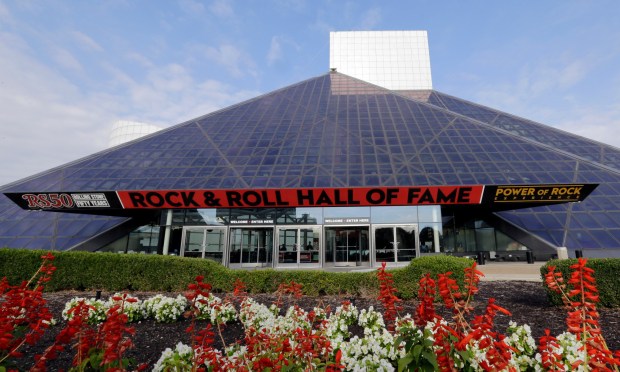 FILE - Signage marks the exterior of the Rock and Roll Hall of Fame, Aug. 30, 2017, in Cleveland. (AP Photo/Tony Dejak, File)