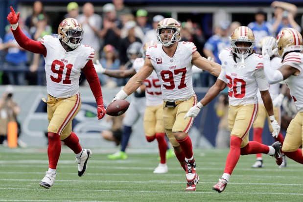 San Francisco 49ers defensive end Nick Bosa (97) runs down the field with the ball during the second half of an NFL football game against the Seattle Seahawks, Sunday, Sept. 7, 2025, in Seattle. (AP Photo/Lindsey Wasson)
