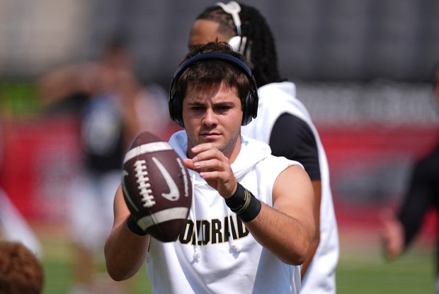 Colorado quarterback Ryan Staub (16) warms up before an NCAA college football game Saturday, Sept. 6, 2025, in Boulder, Colo. (AP Photo/David Zalubowski)