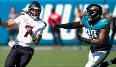 Houston Texans quarterback CJ. Stroud (7) runs the ball as Jacksonville Jaguars defensive end Dawuane Smoot (98) defends during the second half of an NFL football game Sunday, Sept. 21, 2025, in Jacksonville, Fla. (AP Photo/John Raoux)
