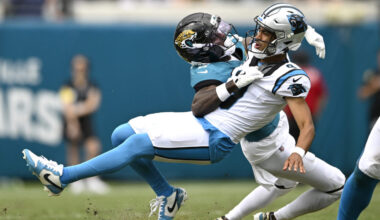 Jacksonville Jaguars cornerback Jourdan Lewis (2) tackles Carolina Panthers quarterback Bryce Young...