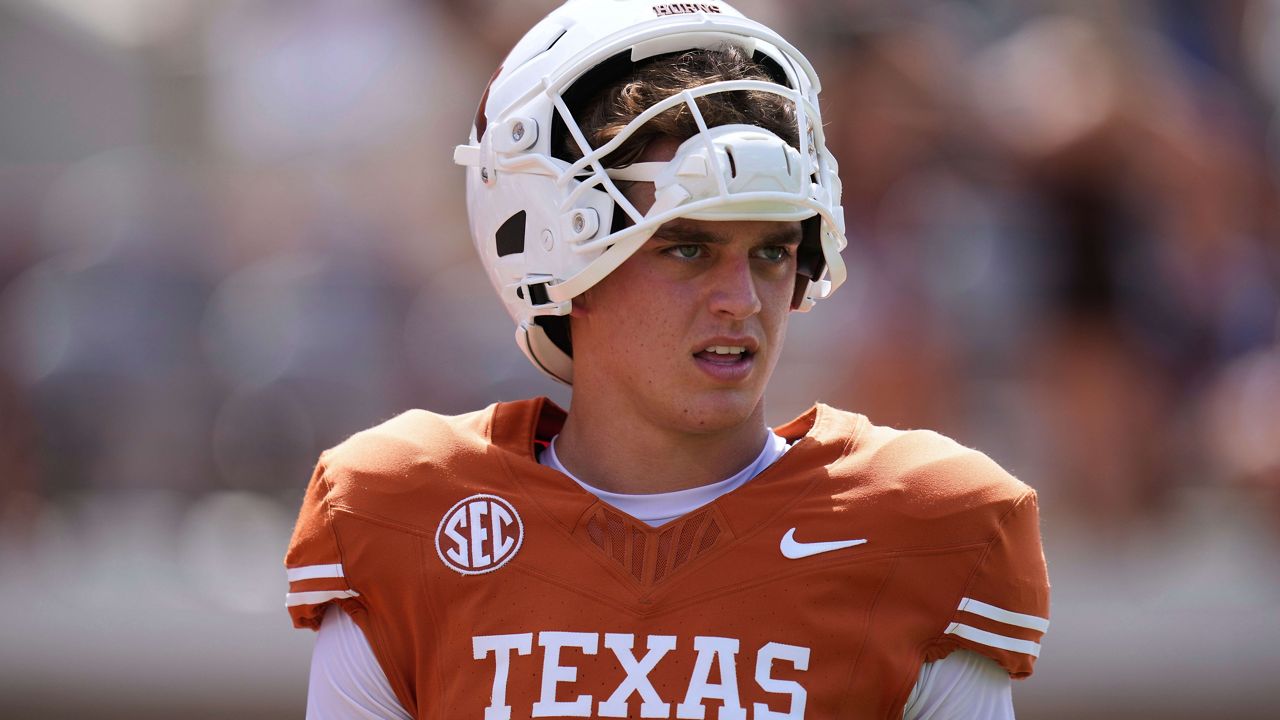 Texas quarterback Arch Manning (16) warms up before an NCAA college football game against UTEP in Austin, Texas, Saturday, Sept. 13, 2025. (AP Photo/Eric Gay)