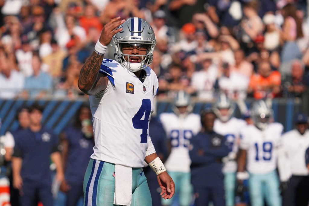 Dallas Cowboys quarterback Dak Prescott signals at the line of scrimmage during the first half of an NFL football game against the Chicago Bears Sunday, Sept. 21, 2025, in Chicago. 