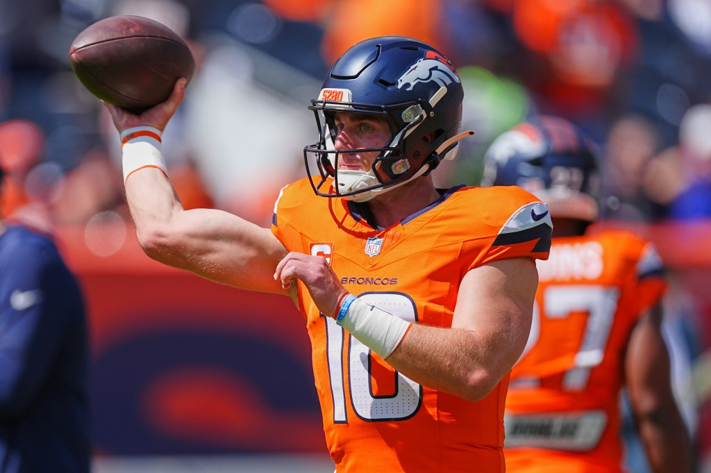 Denver Broncos quarterback throwing a football.