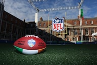 An NFL Dublin football sits on the field at the NFL Experience in Dublin, Thursday, Sept....